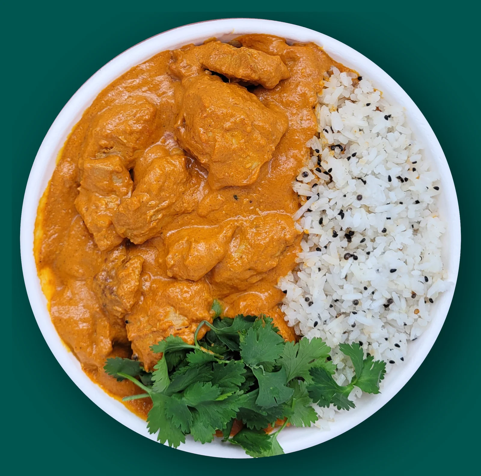 Chicken Tikka Masala: Spiced chicken in a rich sauce of tomato, coconut milk and toasted spices with cardamom rice