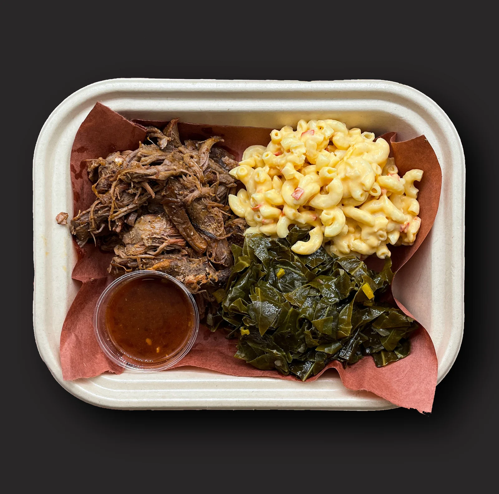 Pulled Pork: Pulled pork, “Franklin” Vinegar Sauce, mac & cheese, collard greens