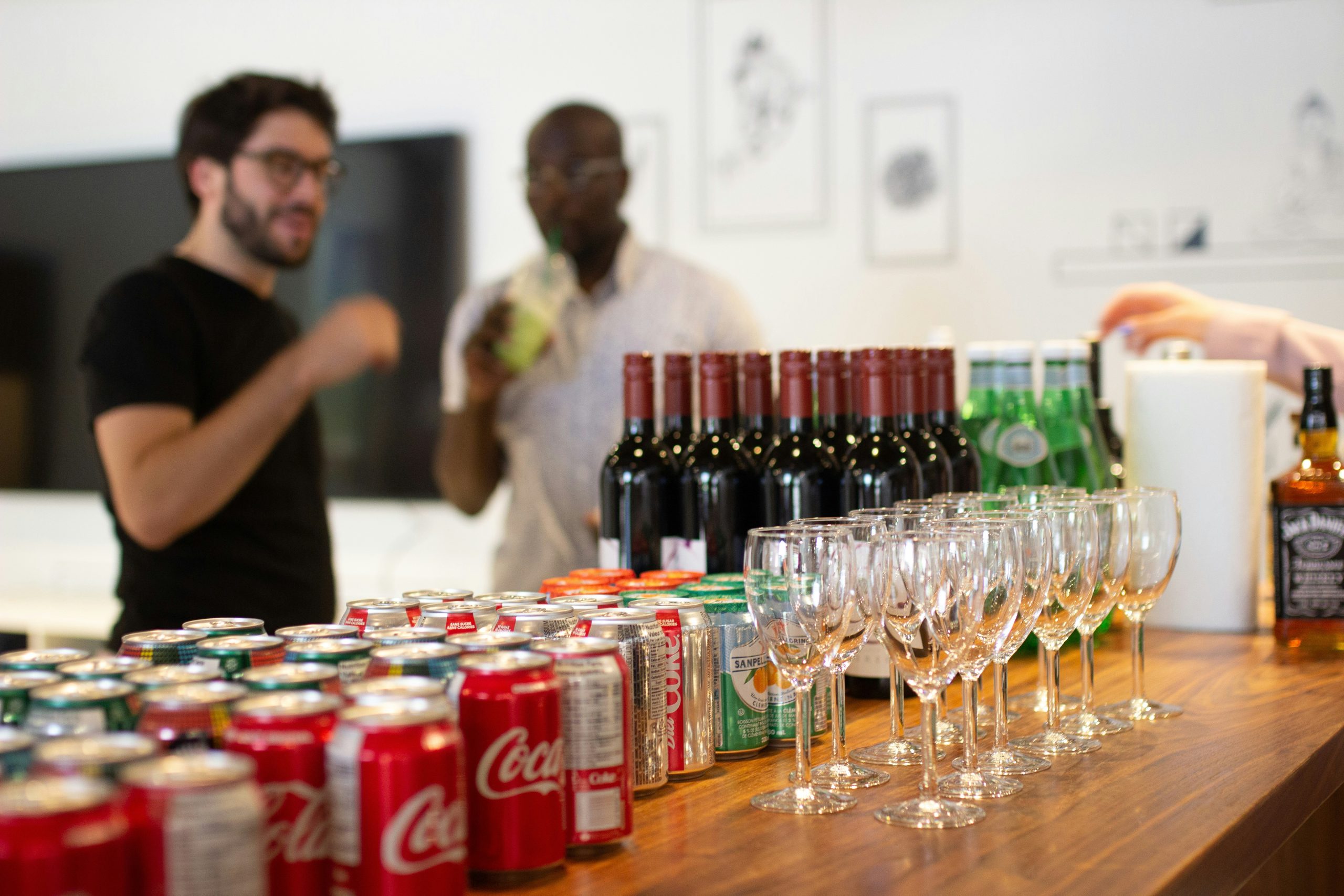 Glasses amd drinks on a wooden counter