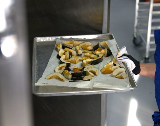 Worker making delicious food at Superfine Kitchen